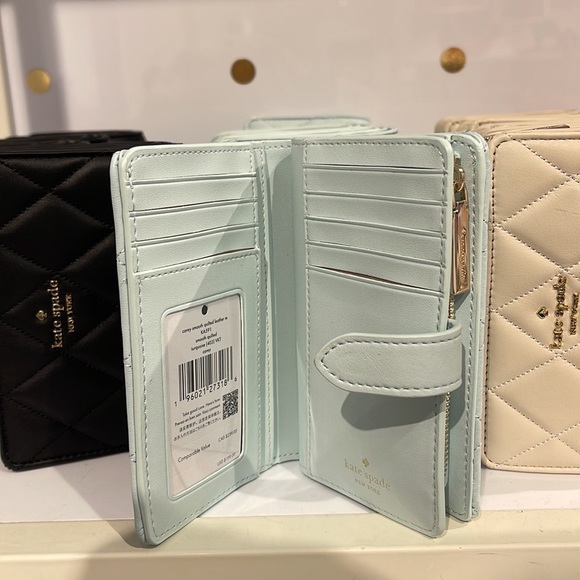Kate Spade Carey Medium Compartment Bifold Wallet
COLOR: Turquoise - Picture 6 of 16